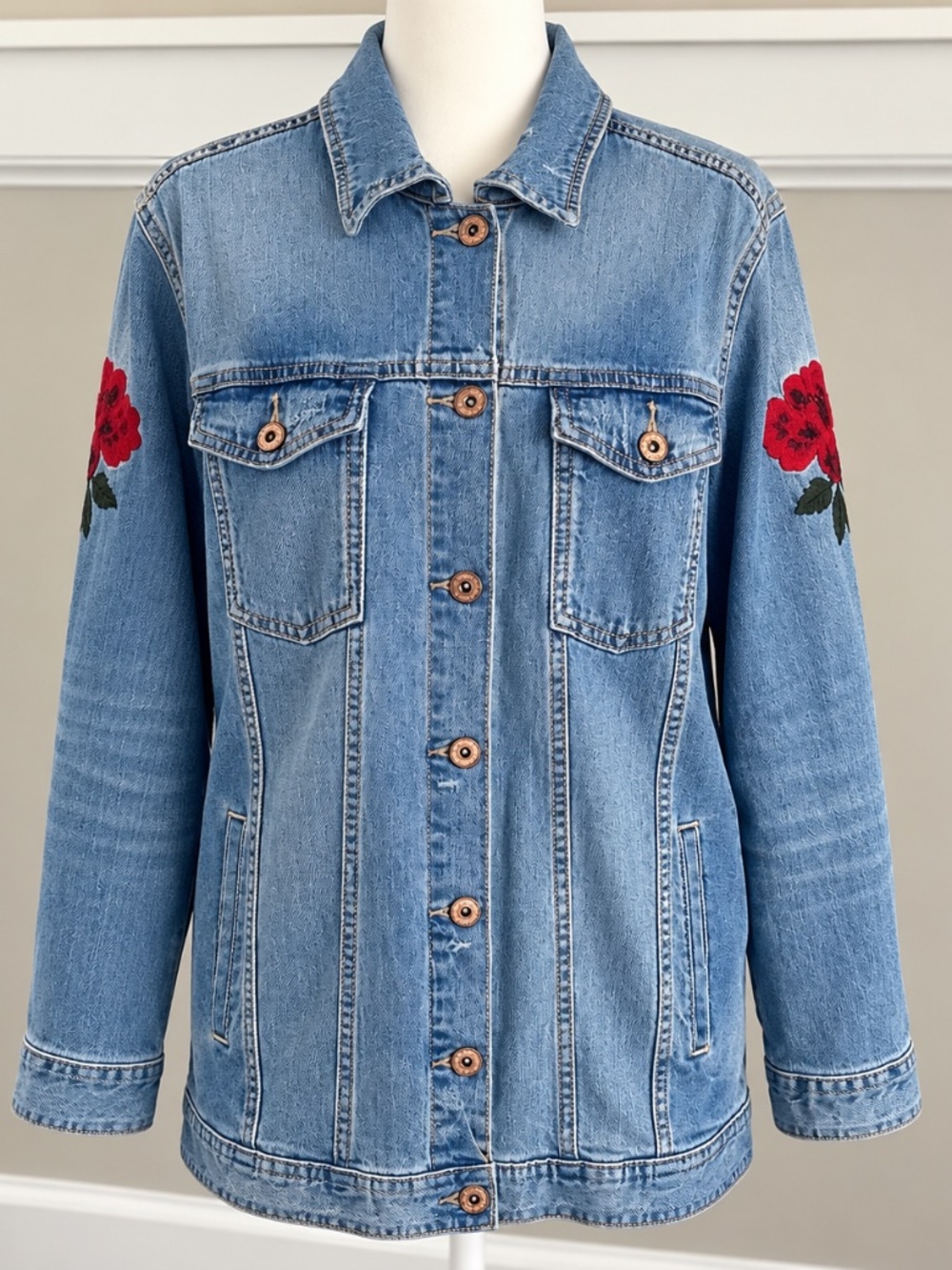 Arizona Jean Co. jacket with red, rose embroidered detail.